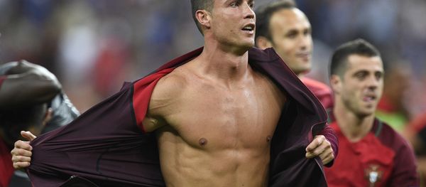 Portugal's forward Cristiano Ronaldo takes off his jacket after beating France 1-0 in the Euro 2016 final football match between France and Portugal at the Stade de France in Saint-Denis, north of Paris, on July 10, 2016. Portugal's forward Cristiano Ronaldo takes off his jacket after beating France 1-0 in the Euro 2016 final football match between France and Portugal at the Stade de France in Saint-Denis, north of Paris, on July 10, 2016. - Sputnik International
