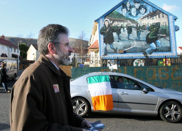Sinn Fein President Gerry Adams passes a Irish Republican Army mural in the Ballymurphy area of west Belfast , Northern Ireland, Tuesday, March, 6, 2007 Sinn Fein President Gerry Adams passes a Irish Republican Army mural in the Ballymurphy area of west Belfast , Northern Ireland, Tuesday, March, 6, 2007 - Sputnik International