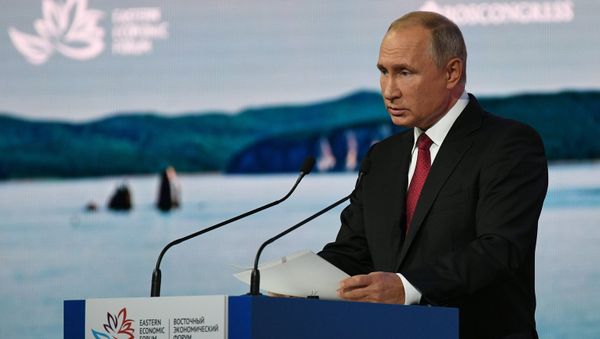 Vladimir Putin is seen giving a speech at a plenary session during the 2018 Eastern Economic Forum on September 12 - Sputnik International