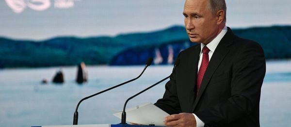 Vladimir Putin is seen giving a speech at a plenary session during the 2018 Eastern Economic Forum on September 12 - Sputnik International