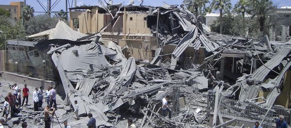 In this photo taken on a government-organized tour, media film damage from what officials said was a NATO airstrike at a hotel, in the capital Tripoli, Libya Thursday, June 16, 2011, while what officials described as a telecommunications tower is seen at left In this photo taken on a government-organized tour, media film damage from what officials said was a NATO airstrike at a hotel, in the capital Tripoli, Libya Thursday, June 16, 2011, while what officials described as a telecommunications tower is seen at left - Sputnik International