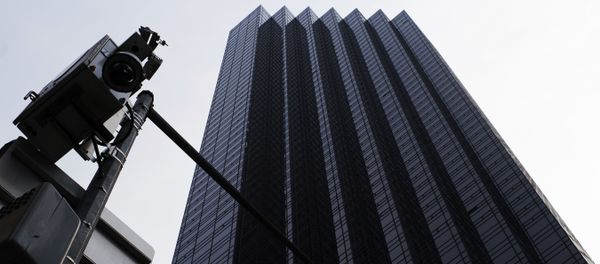 A New York Police Department surveillance camera, left, is mounted on a light pole outside Trump Tower, Monday, Aug. 27, 2018, in New York - Sputnik International