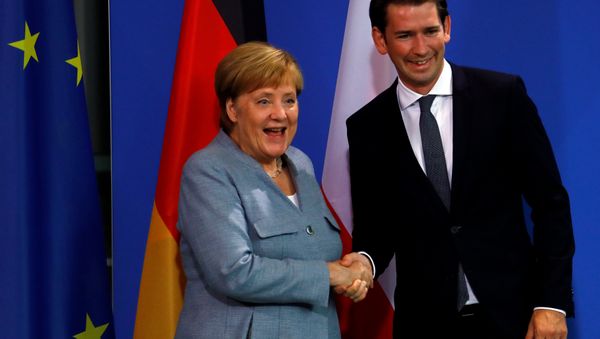 German Chancellor Angela Merkel and Austrian Chancellor Sebastian Kurz shake hands after giving a statment to the media in the chancellery in Berlin, Germany, September 16, 2018. German Chancellor Angela Merkel and Austrian Chancellor Sebastian Kurz shake hands after giving a statment to the media in the chancellery in Berlin, Germany, September 16, 2018. - Sputnik International