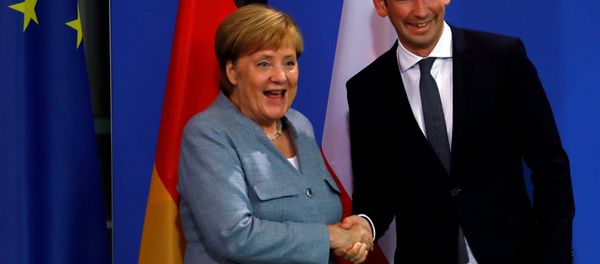 German Chancellor Angela Merkel and Austrian Chancellor Sebastian Kurz shake hands after giving a statment to the media in the chancellery in Berlin, Germany, September 16, 2018. - Sputnik International