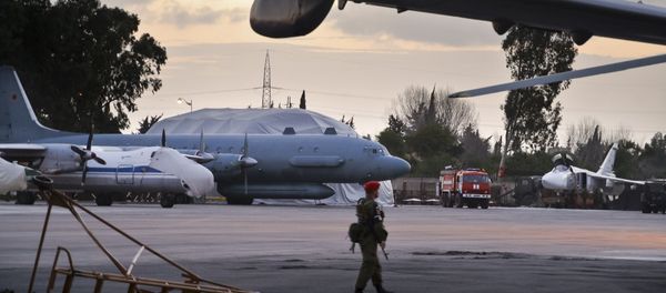 In this photo taken on Friday, March 4, 2016, A Russian military police officer stands guard at the Russian air base in Hemeimeem, Syria, with an Il-20 electronic intelligence plane of the Russian air force is in the background. An Il-20 aircraft was shot down Tuesday, Sept. 18, 2018 by a Syrian missile over the Mediterranean Sea, killing all 15 people on board, as the Syrian military fired on Israeli fighter jets attacking targets in northwestern Syria In this photo taken on Friday, March 4, 2016, A Russian military police officer stands guard at the Russian air base in Hemeimeem, Syria, with an Il-20 electronic intelligence plane of the Russian air force is in the background. An Il-20 aircraft was shot down Tuesday, Sept. 18, 2018 by a Syrian missile over the Mediterranean Sea, killing all 15 people on board, as the Syrian military fired on Israeli fighter jets attacking targets in northwestern Syria - Sputnik International