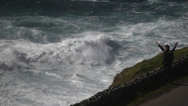 A man looks out at rough sea from Slea Head during Storm Ali in Coumeenoole A man looks out at rough sea from Slea Head during Storm Ali in Coumeenoole - Sputnik International