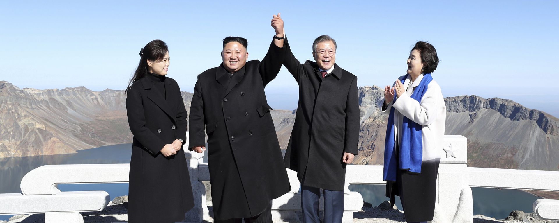South Korean President Moon Jae-in, second from right, and his wife Kim Jung-sook, right, stand with North Korean leader Kim Jong Un, second from left, and his wife Ri Sol Ju on the Mount Paektu in North Korea, Thursday, Sept. 20, 2018 South Korean President Moon Jae-in, second from right, and his wife Kim Jung-sook, right, stand with North Korean leader Kim Jong Un, second from left, and his wife Ri Sol Ju on the Mount Paektu in North Korea, Thursday, Sept. 20, 2018 - Sputnik International, 1920, 09.10.2022