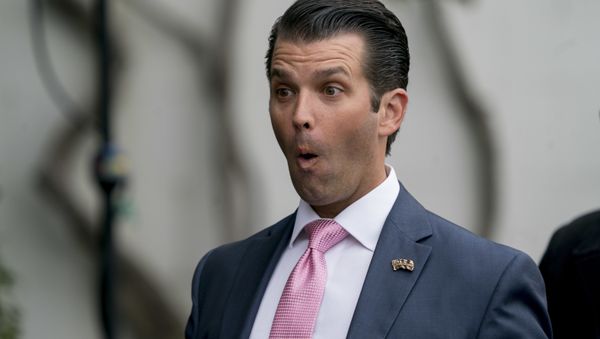 Donald Trump Jr., the son of President Donald Trump, makes a face at one of his children during the annual White House Easter Egg Roll on the South Lawn of the White House in Washington, Monday, April 2, 2018 - Sputnik International