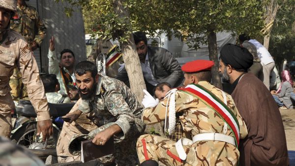 Iranian armed forces members and civilians take shelter in a shooting during a military parade marking the 38th anniversary of Iraq's 1980 invasion of Iran Iranian armed forces members and civilians take shelter in a shooting during a military parade marking the 38th anniversary of Iraq's 1980 invasion of Iran - Sputnik International
