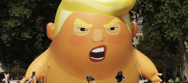 A 20-foot high cartoon baby blimp of US President Donald Trump A 20-foot high cartoon baby blimp of US President Donald Trump - Sputnik International