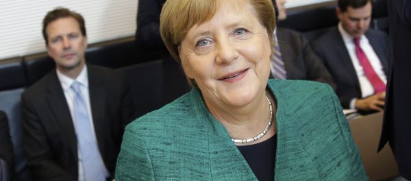 Christian Democratic Union Chairwoman and German Chancellor Angela Merkel arrives for a faction meeting of her ruling Christian Union parties at the Reichstag building in Berlin, Tuesday, Sept. 25, 2018. Christian Democratic Union Chairwoman and German Chancellor Angela Merkel arrives for a faction meeting of her ruling Christian Union parties at the Reichstag building in Berlin, Tuesday, Sept. 25, 2018. - Sputnik International