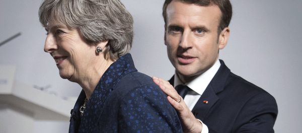 Britain's Prime Minister Theresa May and French President Emmanuel Macron during a media conference at the Royal Military Academy Sandhurst, in Camberley, England, after UK-France summit talks, Thursday Jan. 18, 2018. Britain's Prime Minister Theresa May and French President Emmanuel Macron during a media conference at the Royal Military Academy Sandhurst, in Camberley, England, after UK-France summit talks, Thursday Jan. 18, 2018. - Sputnik International