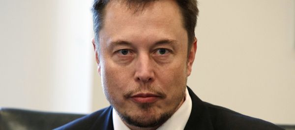 In this Dec. 14, 2016, file photo, Tesla CEO Elon Musk listens as President-elect Donald Trump speaks during a meeting with technology industry leaders at Trump Tower in New York. - Sputnik International