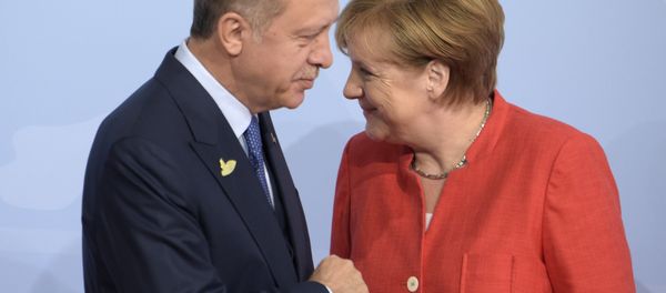 Turkish President Recep Tayyip Erdogan, left, is welcomed by German Chancellor Angela Merkel on the first day of the G-20 summit in Hamburg, northern Germany, Friday, July 7, 2017 Turkish President Recep Tayyip Erdogan, left, is welcomed by German Chancellor Angela Merkel on the first day of the G-20 summit in Hamburg, northern Germany, Friday, July 7, 2017 - Sputnik International