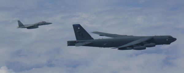 US B-52 bomber flies across East China Sea with two Koku Jieitai (Japan Air Self-Defense Force) F-15 fighters US B-52 bomber flies across East China Sea with two Koku Jieitai (Japan Air Self-Defense Force) F-15 fighters - Sputnik International