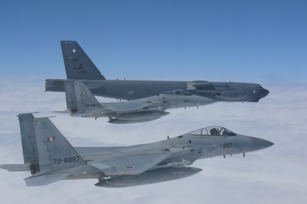A US Air Force B-52H Stratofortress bomber and two Koku Jieitai (Japan Air Self-Defense Force) F-15 fighters execute a routine bilateral training mission over the East China Sea and the Sea of Japan, Sept. 26, 2018. A US Air Force B-52H Stratofortress bomber and two Koku Jieitai (Japan Air Self-Defense Force) F-15 fighters execute a routine bilateral training mission over the East China Sea and the Sea of Japan, Sept. 26, 2018. - Sputnik International