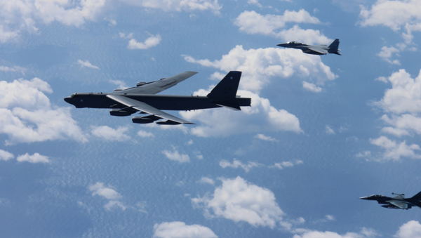 American B-52 bombers conducts bilateral training mission with 12 Koku Jieitai F-15s and 4 F-2s with the Japan Air Self-Defense Force  - Sputnik International