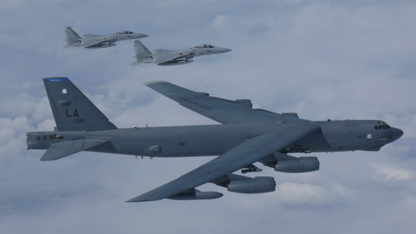 A B-52H Stratofortress bomber aircraft integrated with the Koku Jieitai (Japan Air Self Defense Force) while conducting a routine training mission in the East China Sea and Sea of Japan Sep. 26, 2018 - Sputnik International