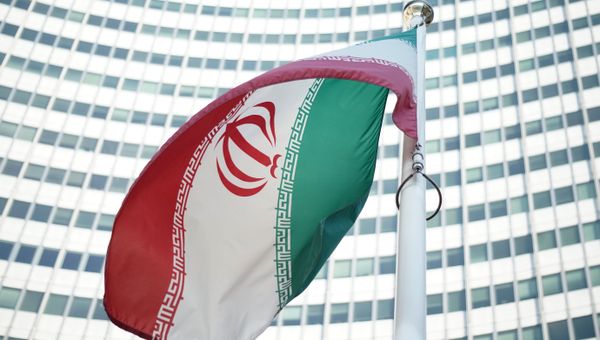 An Iranian flag waves in a wind outside the Vienna International Centre hosting the United Nations (UN) headquarters and the International Atomic Energy Agency (IAEA) as the socalled EU 5+1 talks with Iran take place in Vienna, on July 3, 2014. An Iranian flag waves in a wind outside the Vienna International Centre hosting the United Nations (UN) headquarters and the International Atomic Energy Agency (IAEA) as the socalled EU 5+1 talks with Iran take place in Vienna, on July 3, 2014. - Sputnik International