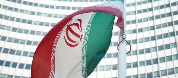 An Iranian flag waves in a wind outside the Vienna International Centre hosting the United Nations (UN) headquarters and the International Atomic Energy Agency (IAEA) as the socalled EU 5+1 talks with Iran take place in Vienna, on July 3, 2014. An Iranian flag waves in a wind outside the Vienna International Centre hosting the United Nations (UN) headquarters and the International Atomic Energy Agency (IAEA) as the socalled EU 5+1 talks with Iran take place in Vienna, on July 3, 2014. - Sputnik International