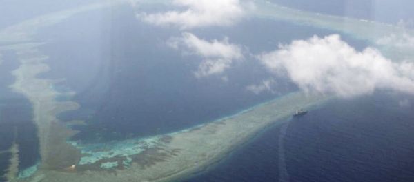 In this Aug. 31, 2018, file photo provided by the Armed Forces of the Philippines, the Philippine Navy ship BRP Gregorio del Pilar is seen at center right after it ran aground during a routine patrol, on Aug. 29, in the vicinity of Half Moon Shoal, which is called Hasa Hasa in the Philippines, off the disputed Spratlys Group of islands in the South China Sea In this Aug. 31, 2018, file photo provided by the Armed Forces of the Philippines, the Philippine Navy ship BRP Gregorio del Pilar is seen at center right after it ran aground during a routine patrol, on Aug. 29, in the vicinity of Half Moon Shoal, which is called Hasa Hasa in the Philippines, off the disputed Spratlys Group of islands in the South China Sea - Sputnik International
