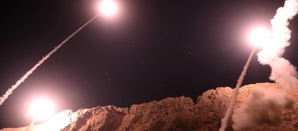 In this photo released on Monday, Oct. 1, 2018, by the Iranian Revolutionary Guard, missiles are fired from city of Kermanshah in western Iran targeting the Islamic State group in Syria. - Sputnik International