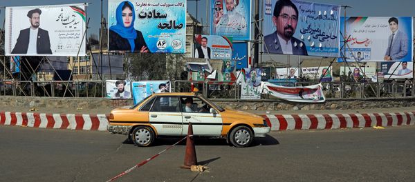 A vehicle drives in front of election posters of parliamentarian candidates installed during the first day of elections campaign in Kabul, Afghanistan September 28, 2018 A vehicle drives in front of election posters of parliamentarian candidates installed during the first day of elections campaign in Kabul, Afghanistan September 28, 2018 - Sputnik International