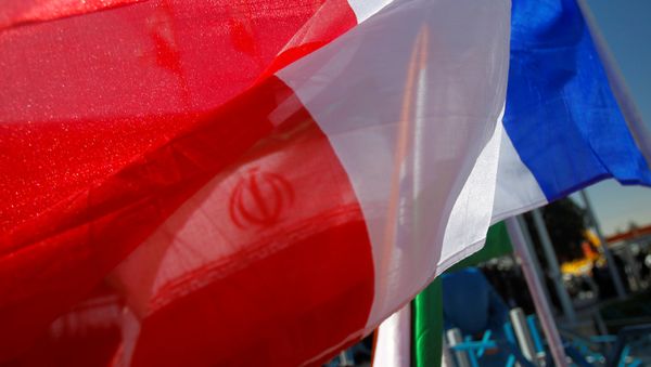 France national flag flutters as an Iranian flag is seen behind (File) France national flag flutters as an Iranian flag is seen behind (File) - Sputnik International