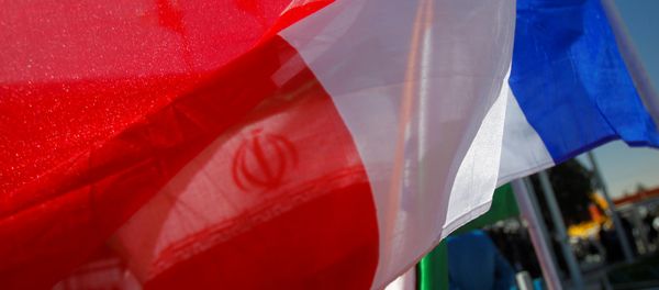 France national flag flutters as an Iranian flag is seen behind (File) France national flag flutters as an Iranian flag is seen behind (File) - Sputnik International