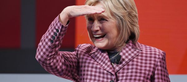 Former Secretary of State Hillary Clinton shields her eyes as she takes her seat to talk with Jeffrey Goldberg, editor in chief of The Atlantic, during The Atlantic Festival, Tuesday, Oct. 2, 2018, in Washington. Former Secretary of State Hillary Clinton shields her eyes as she takes her seat to talk with Jeffrey Goldberg, editor in chief of The Atlantic, during The Atlantic Festival, Tuesday, Oct. 2, 2018, in Washington. - Sputnik International