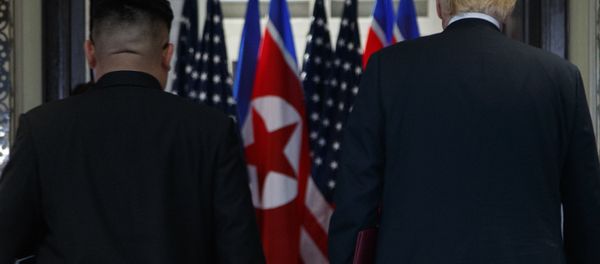 President Donald Trump and North Korean leader Kim Jong Un participate in a signing ceremony during a meeting on Sentosa Island, Tuesday, June 12, 2018, in Singapore President Donald Trump and North Korean leader Kim Jong Un participate in a signing ceremony during a meeting on Sentosa Island, Tuesday, June 12, 2018, in Singapore - Sputnik International