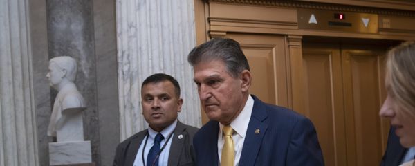 Sen. Joe Manchin, D-W.Va., arrives at the chamber for a procedural vote to advance the confirmation of Supreme Court nominee Brett Kavanaugh, at the Capitol in Washington, Friday, Oct. 5, 2018. Sen. Joe Manchin, D-W.Va., arrives at the chamber for a procedural vote to advance the confirmation of Supreme Court nominee Brett Kavanaugh, at the Capitol in Washington, Friday, Oct. 5, 2018. - Sputnik International
