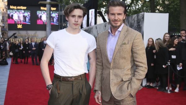 Actor David Beckham, right, poses with his son Brooklyn Beckham for photographers upon arrival at the premiere of the film 'King Arthur The Legend Of The Sword'', in London, Wednesday, May 10, 2017 - Sputnik International