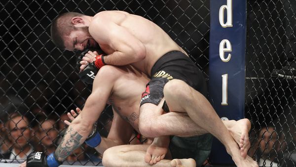 Khabib Nurmagomedov, top, applies a rear naked choke hold to Conor McGregor during a lightweight title mixed martial arts bout at UFC 229 in Las Vegas, Saturday, Oct. 6, 2018 Khabib Nurmagomedov, top, applies a rear naked choke hold to Conor McGregor during a lightweight title mixed martial arts bout at UFC 229 in Las Vegas, Saturday, Oct. 6, 2018 - Sputnik International
