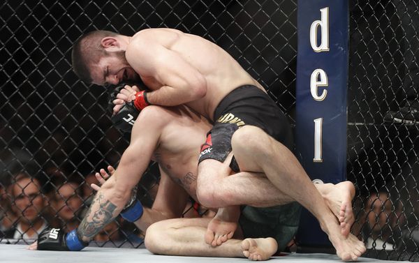 Khabib Nurmagomedov, top, applies a rear naked choke hold to Conor McGregor during a lightweight title mixed martial arts bout at UFC 229 in Las Vegas, Saturday, Oct. 6, 2018 Khabib Nurmagomedov, top, applies a rear naked choke hold to Conor McGregor during a lightweight title mixed martial arts bout at UFC 229 in Las Vegas, Saturday, Oct. 6, 2018 - Sputnik International