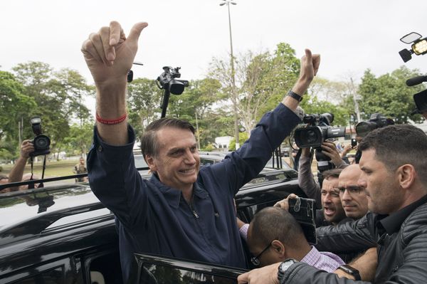 Presidential frontrunner Jair Bolsonaro, of the Social Liberal Party, flashes thumbs up to supporters after voting at a polling station in Rio de Janeiro, Brazil, Sunday, Oct. 7, 2018. Presidential frontrunner Jair Bolsonaro, of the Social Liberal Party, flashes thumbs up to supporters after voting at a polling station in Rio de Janeiro, Brazil, Sunday, Oct. 7, 2018. - Sputnik International