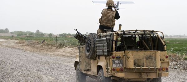 A soldier of Bravo Company, 1 Rifles launches a Desert Hawk UAV (Unmanned Aerial Vehicle) from a WMIK Landrover during an operation near Garmsir, Afghanistan. A soldier of Bravo Company, 1 Rifles launches a Desert Hawk UAV (Unmanned Aerial Vehicle) from a WMIK Landrover during an operation near Garmsir, Afghanistan. - Sputnik International