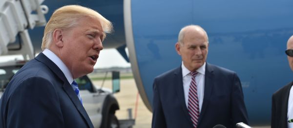 US President Donald Trump speaks to the press before making his way to board Air Force One on May 4, 2018 at Andrews Air Force Base, Maryland as he heads to Dallas, Texas to address the National Rifle Association Leadership Forum. Shown (C) is White House Chief of Staff John Kelly. US President Donald Trump speaks to the press before making his way to board Air Force One on May 4, 2018 at Andrews Air Force Base, Maryland as he heads to Dallas, Texas to address the National Rifle Association Leadership Forum. Shown (C) is White House Chief of Staff John Kelly. - Sputnik International
