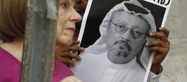 People hold signs during a protest at the Embassy of Saudi Arabia about the disappearance of Saudi journalist Jamal Khashoggi, Wednesday, Oct. 10, 2018, in Washington. - Sputnik International