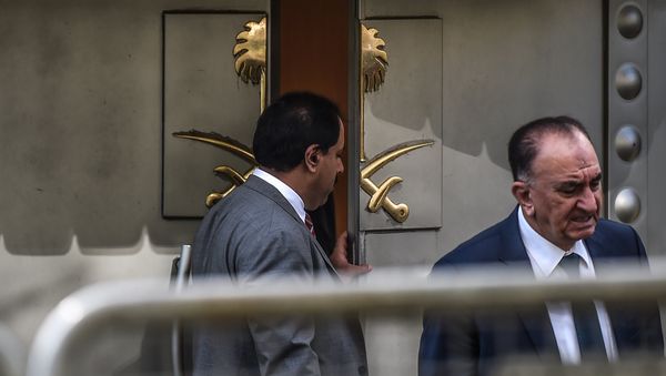 A Saudi official opens the door of the Saudi Arabian consulate in Istanbul on October 8, 2018 in Istanbul during a demonstration for missing journalist Jamal Khashoggi. A Saudi official opens the door of the Saudi Arabian consulate in Istanbul on October 8, 2018 in Istanbul during a demonstration for missing journalist Jamal Khashoggi. - Sputnik International