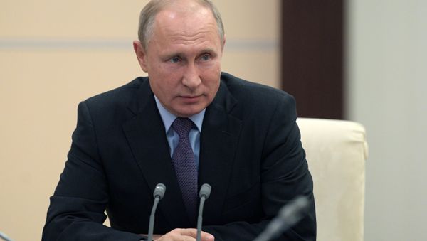 Russian President Vladimir Putin during a meeting with permanent members of Russia's Security Council on October 12, 2018 - Sputnik International