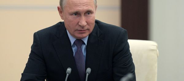 Russian President Vladimir Putin during a meeting with permanent members of Russia's Security Council on October 12, 2018 - Sputnik International