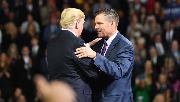 US President Donald Trump (L) greets Kansas gubernatorial candidate Kris Kobach during a Make America Great Again rally in Topeka, Kansas, on October 6, 2018. US President Donald Trump (L) greets Kansas gubernatorial candidate Kris Kobach during a Make America Great Again rally in Topeka, Kansas, on October 6, 2018. - Sputnik International