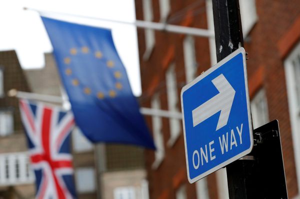 A traffic sign is seen in front of European and Union flags in London, Britain - Sputnik International