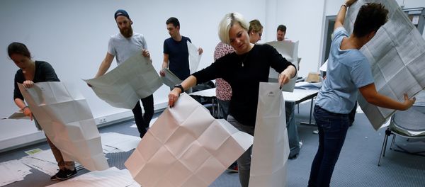 Electoral officials sort ballot papers after the conclusion of voting in the Bavarian state election in Munich, Germany Electoral officials sort ballot papers after the conclusion of voting in the Bavarian state election in Munich, Germany - Sputnik International