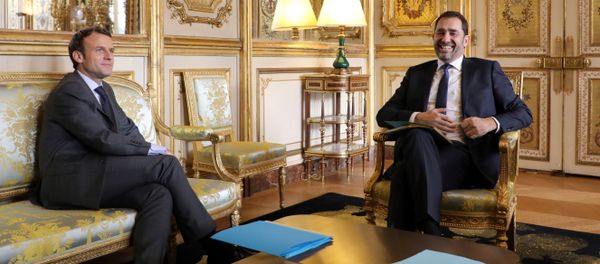 French president Emmanuel Macron (L) speaks with La Republique en Marche (Republic on the Move - LREM) centrist party new leader Christophe Castaner, at the Elysee palace on november 20, 2017 in Paris. - Sputnik International
