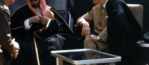 The U.S. President Franklin D. Roosevelt meets with King Ibn Saud of Saudi Arabia, on board the U.S. Navy heavy cruiser USS Quincy (CA-71) in the Great Bitter Lake, Egypt, on 14 February 1945. The King is speaking to the interpreter, Colonel William A. Eddy, USMC. - Sputnik International