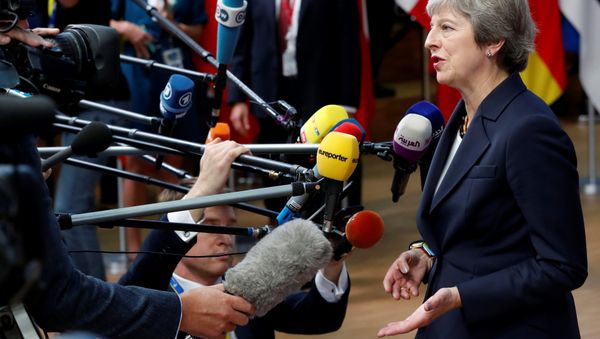 Britain's Prime Minister Theresa May arrives at an European Union leaders summit in Brussels, Belgium October 17, 2018. Britain's Prime Minister Theresa May arrives at an European Union leaders summit in Brussels, Belgium October 17, 2018. - Sputnik International