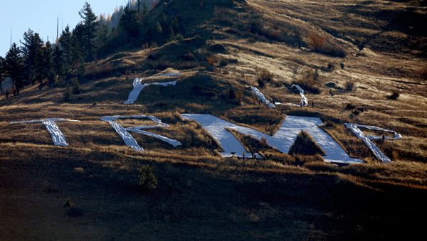 Activist use fabric to spell out a temporary message around the concrete M above the University of Montana ahead of U.S. President Donald Trump's arrival to Missoula. Activist use fabric to spell out a temporary message around the concrete M above the University of Montana ahead of U.S. President Donald Trump's arrival to Missoula. - Sputnik International