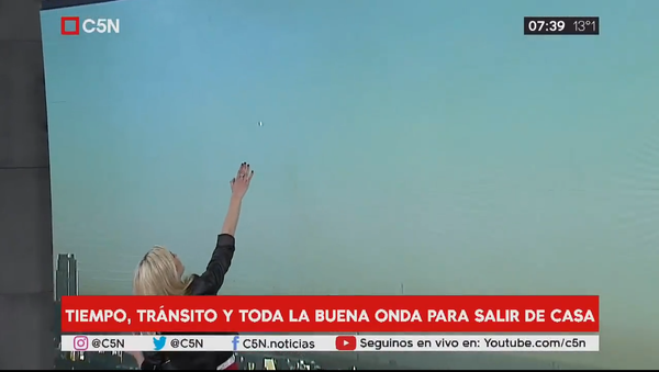 Metallic UFO Appears Live On Morning News Broadcast. Buenos Aires, Argentina - Sputnik International